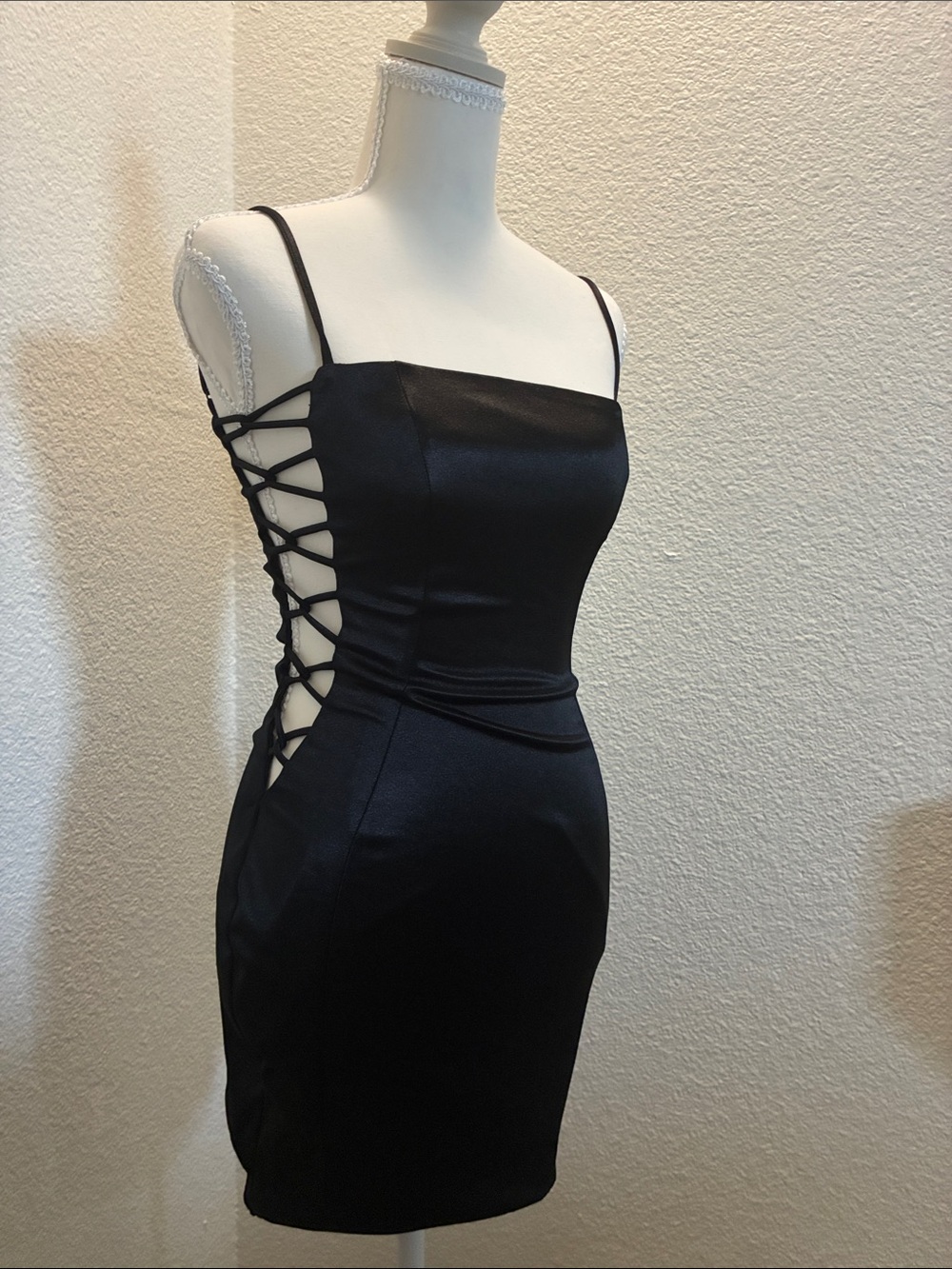Black club or event dress. Open side